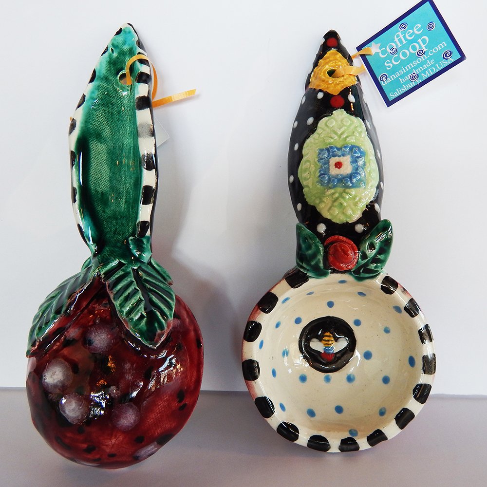 Danasimson.com Handmade Bee & Rose Coffee Scoop is about 7 inches by 3,” in colorful ceramic. I sculpt a hand twisted clay rose and create a richly patterned surface. A small rather pleasant bee is stamped in the 1/2 cup scoop area.